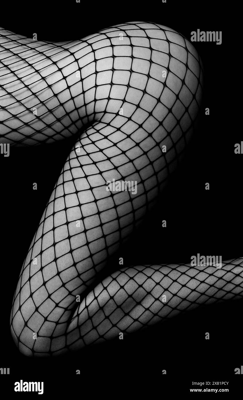 Legs in fishnet tights hi-res stock photography and images - Alamy