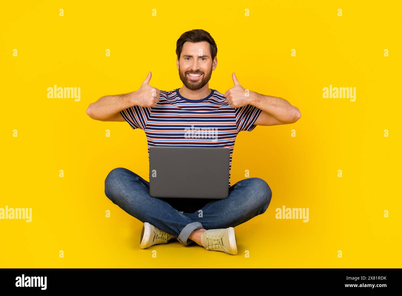Photo of young modern guy with laptop likes symbol thumbs up enjoy ...