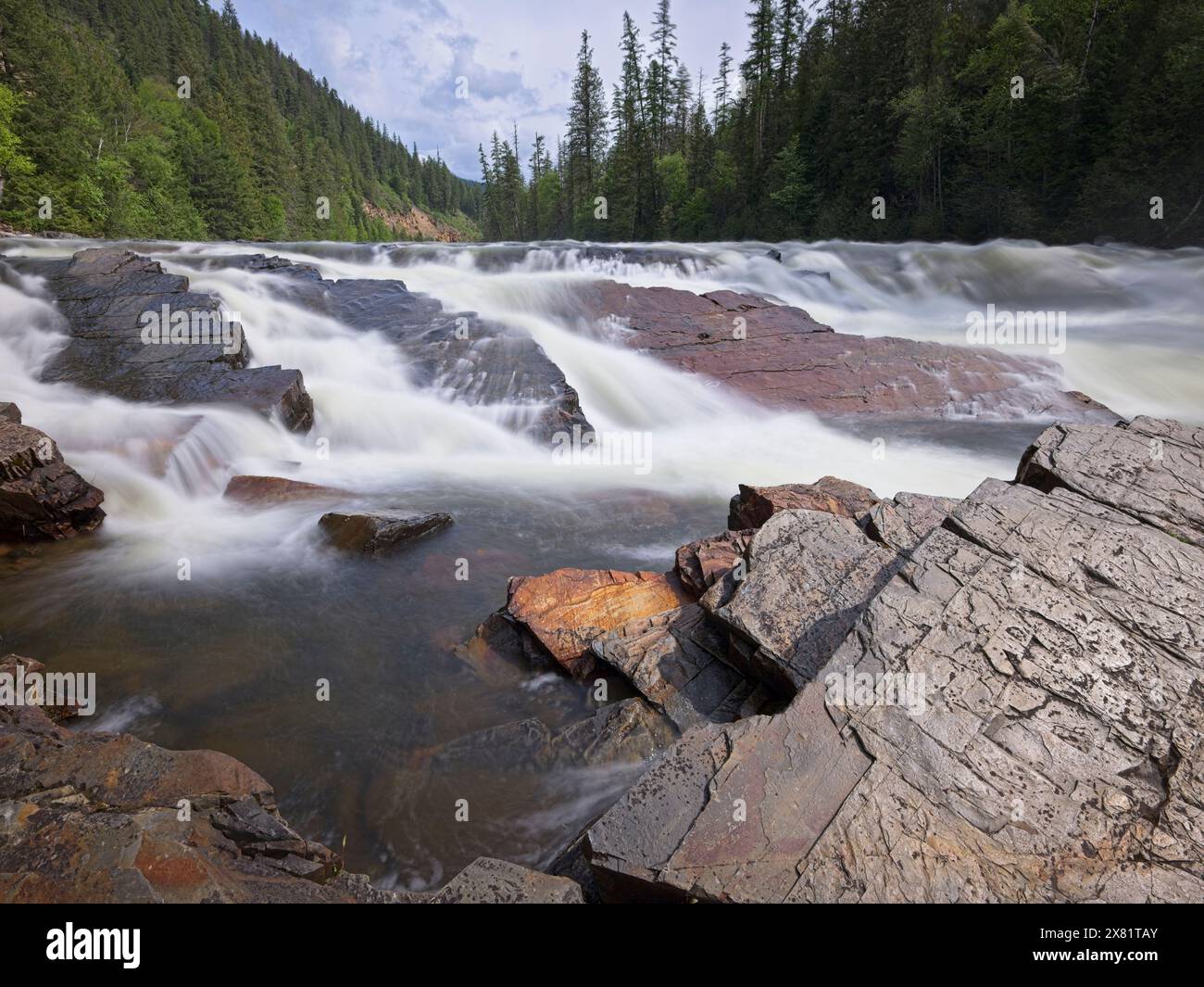 The strong rush of the Yaak Falls in northwest Montana on a spring day. Stock Photo