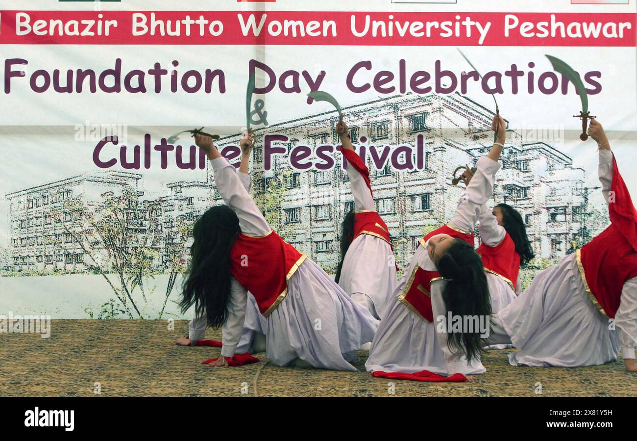 Students are presenting a tableau on stage during Foundation Day ceremony of the Shaheed Benazir Bhutto Women University, held at university premises in Peshawar on Wednesday, May 22, 2024. Stock Photo
