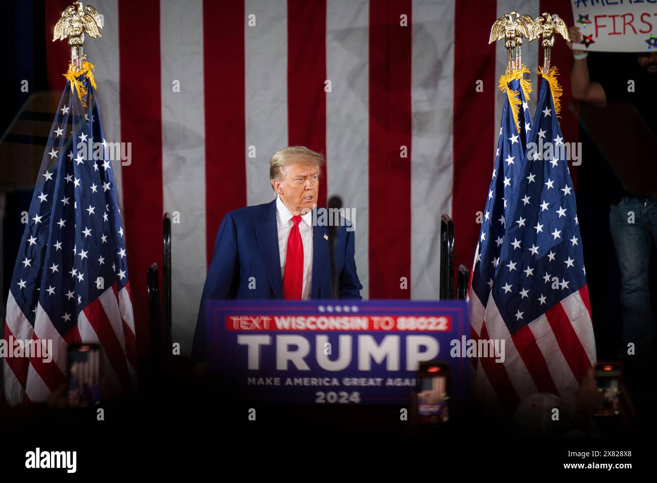 Donald Trump walks on stage at a campaign rally in Waukesha, Wisconsin ...