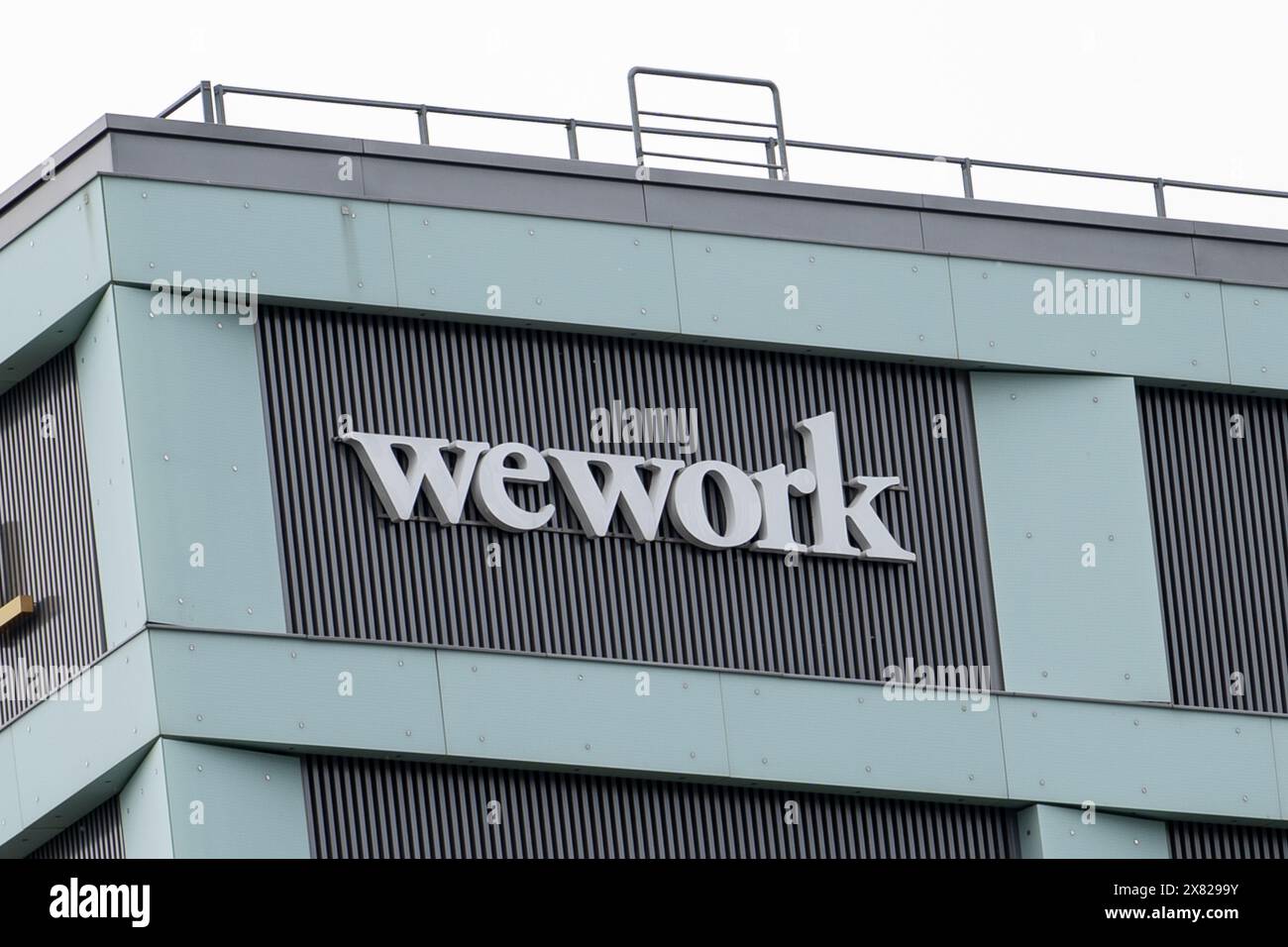 The wework logo is seen at the high street in Warsaw. The country is ...