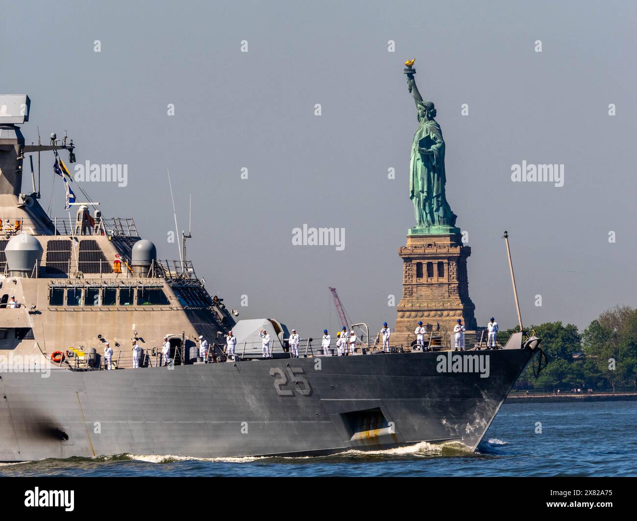 New York, New York, USA. 22nd May, 2024. USS MARINETTE (LCS 25) passes by the Statue of Liberty. The start of Memorial Day celebrations in New York City commences with the Parade of Ships up the Hudson River. (Credit Image: © Carlos Chiossone/ZUMA Press Wire) EDITORIAL USAGE ONLY! Not for Commercial USAGE! Stock Photo