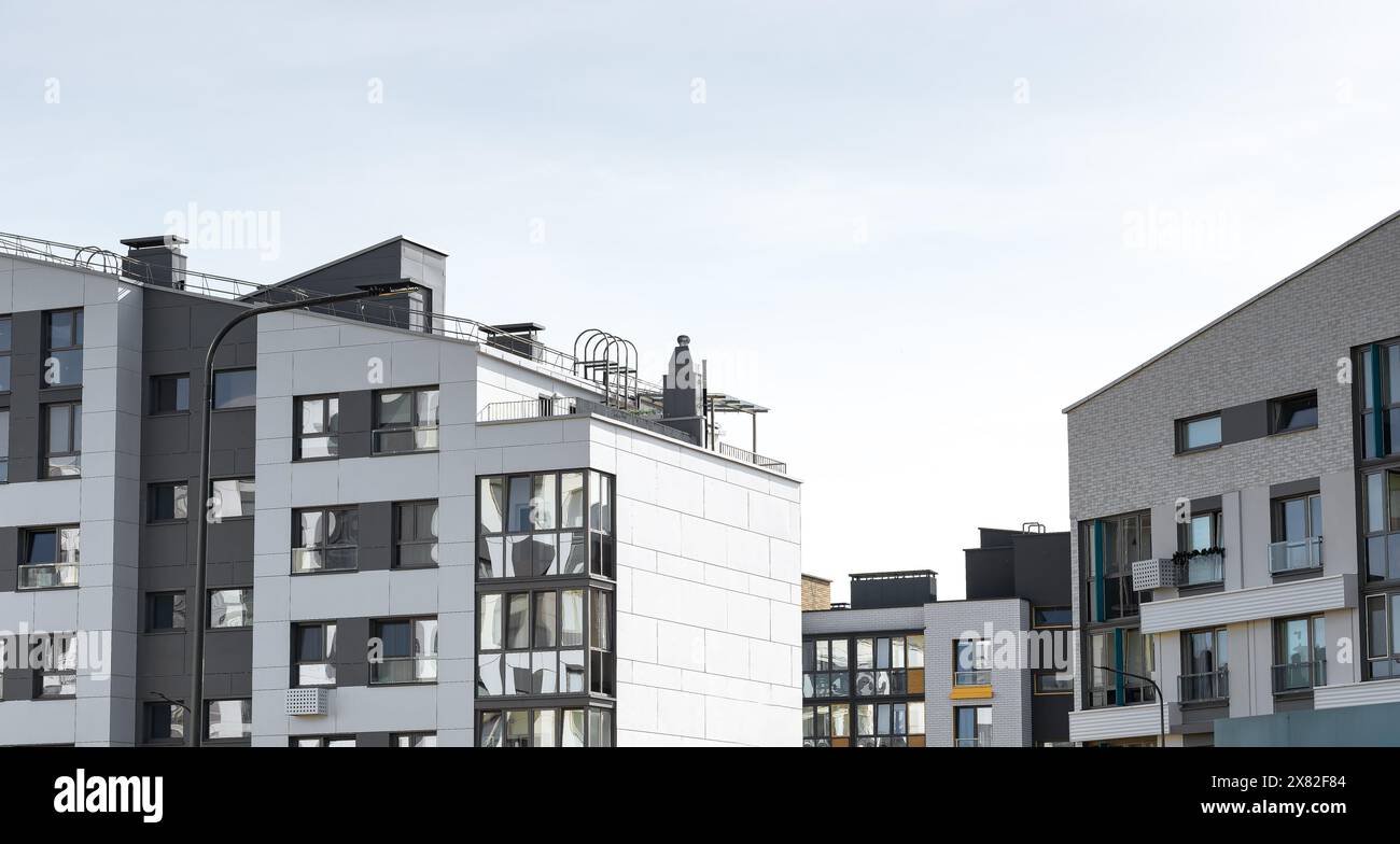 Modern residential building, urban condominium complex. Stylish new ... - Secure European Apartment Complexes With Building Automation System Camera