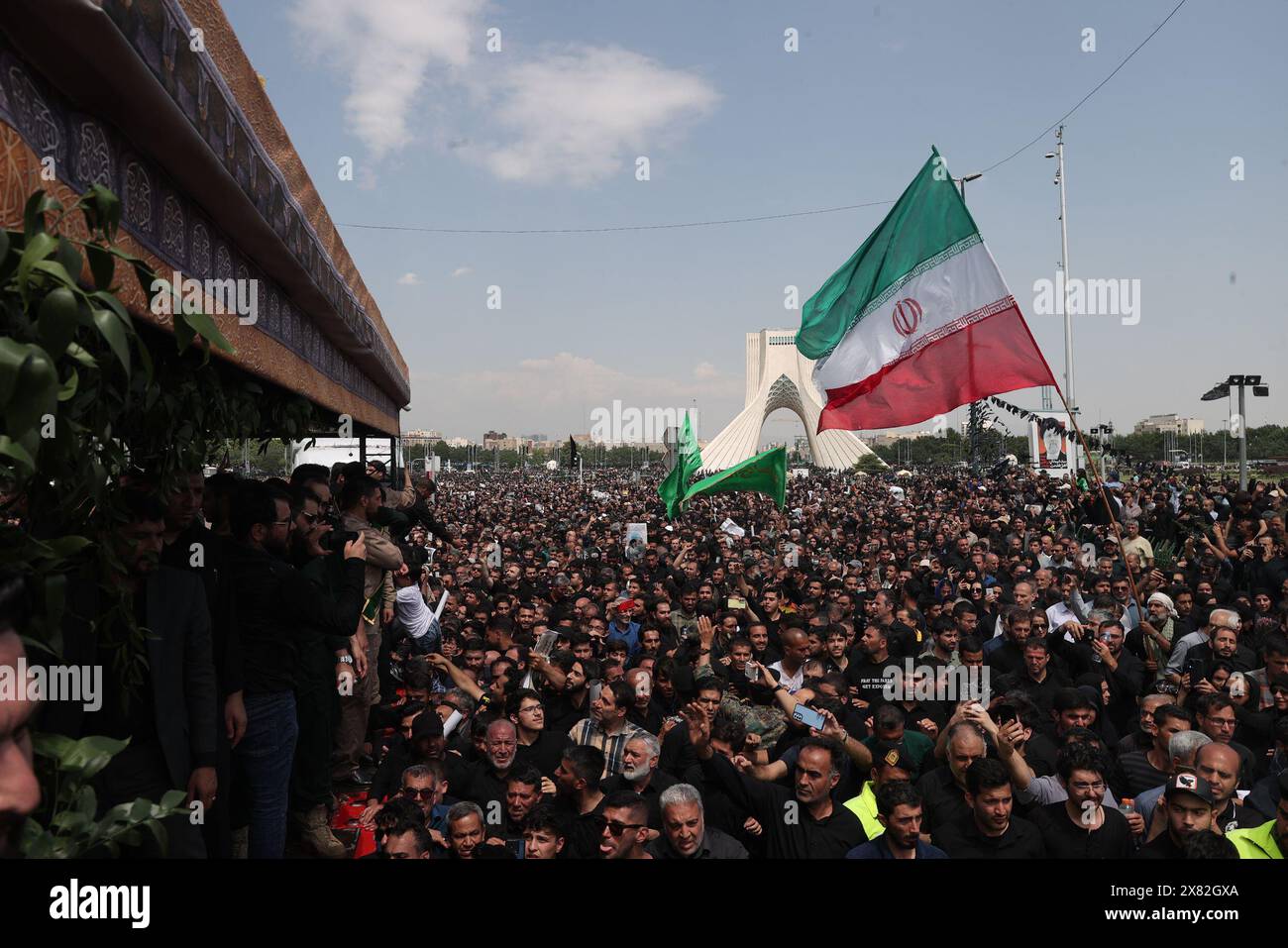 May 22, 2024, Tehran, Iran: Iranians mourners follow a truck carrying coffins of the late President Ebrahim Raisi and his companions, who were killed in a helicopter crash in a mountainous region of the country's northwest, during a funeral ceremony for them in Tehran. Iran's supreme leader presided over the funeral Wednesday for the country's late president, foreign minister, and others killed in the helicopter crash, as tens of thousands later followed a procession of their caskets through the capital, Tehran. (Credit Image: © Iranian Presidency via ZUMA Press Wire) EDITORIAL USAGE ONLY! Not Stock Photo