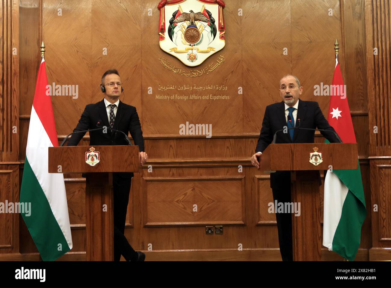 Amman, Jordan. 22nd May, 2024. Jordanian Foreign Minister Ayman Safadi (R) and Hungarian Minister of Foreign Affairs and Trade Peter Szijjarto attend a joint press conference in Amman, Jordan, on May 22, 2024. Jordanian Foreign Minister Ayman Safadi said on Wednesday the situation in the West Bank was worsening, blaming Israel's 'illegal and repressive measures' for killing opportunities for peace. Safadi made the remarks during a joint press conference in Amman with visiting Hungarian Minister of Foreign Affairs and Trade Peter Szijjarto. Credit: Mohammad Abu Ghosh/Xinhua/Alamy Live News Stock Photo