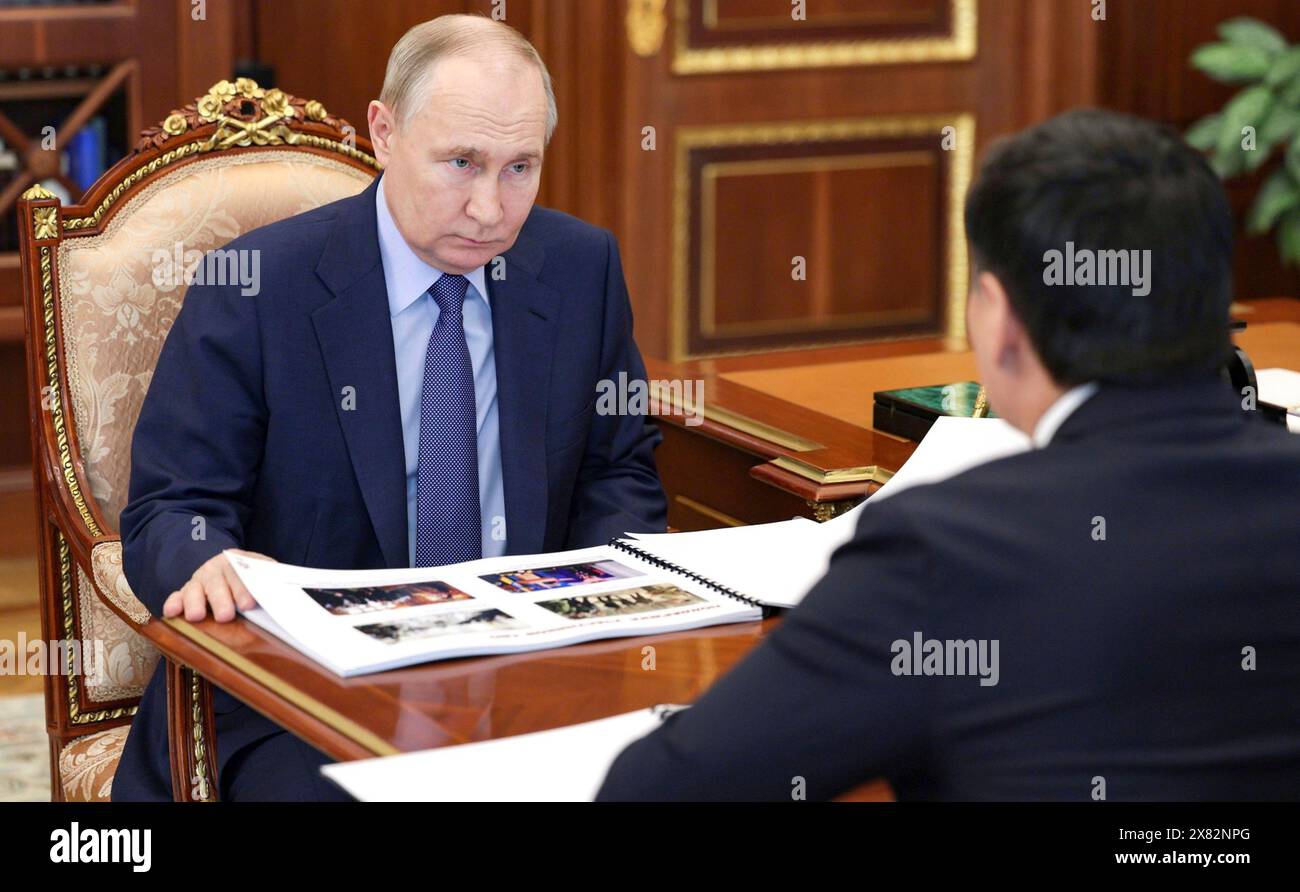 Moscow, Russia. 21st May, 2024. Russian President Vladimir Putin listens to Kalmykia Republic head Batu Khasikov, right, during face-to-face meeting at the Kremlin, May 21, 2024, in Moscow, Russia. Credit: Alexander Kazakov/Kremlin Pool/Alamy Live News Stock Photo