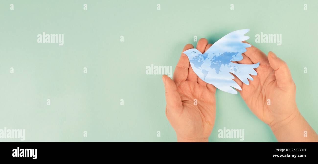 Dove flying from hand international - Dove Flying From Hand International Peace Day Faith Freedom Charity And Help Concept Humanitarian Aid World Map 2X82YTH 