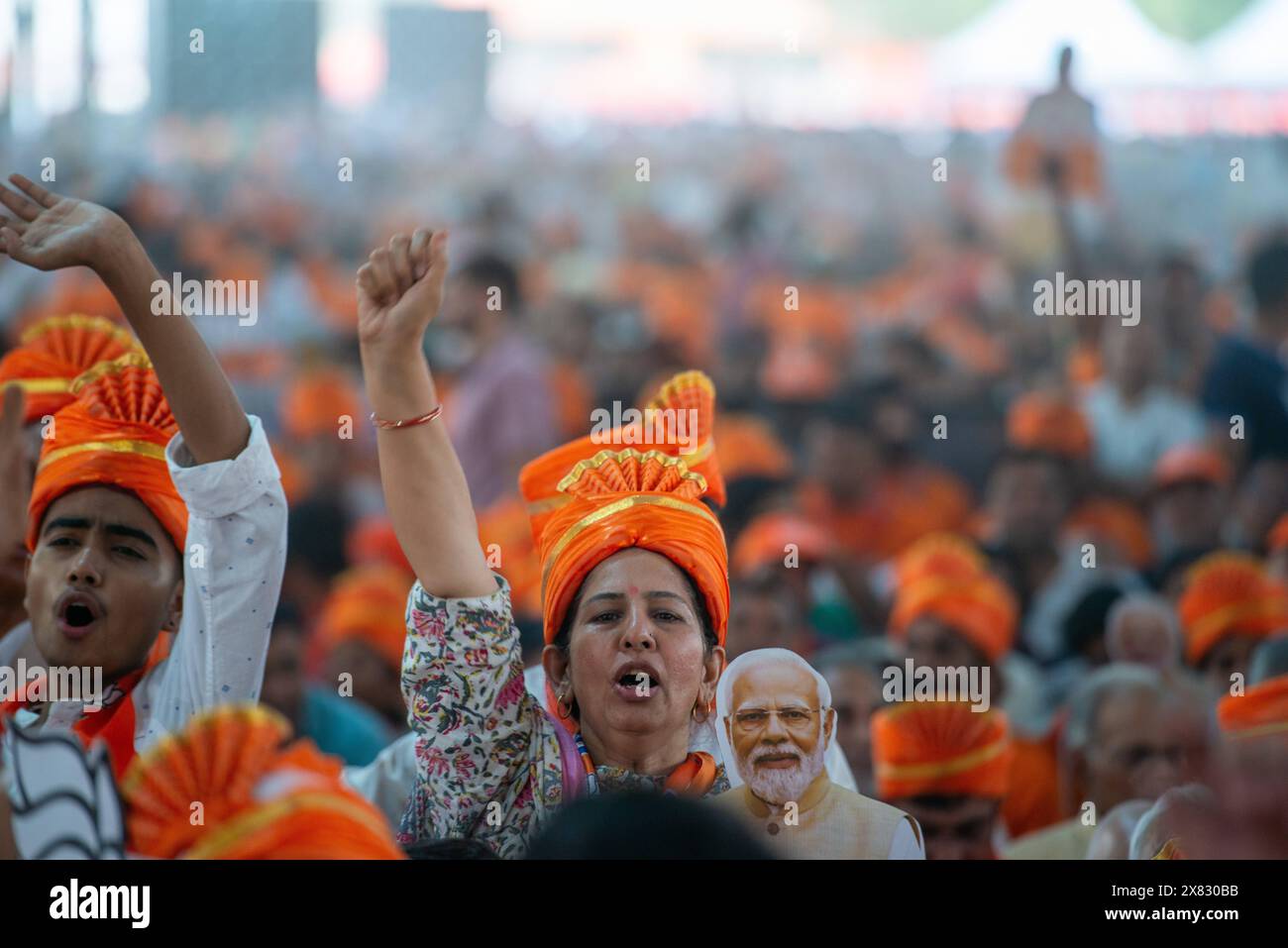 New Delhi, India. 22nd May, 2024. BJP party supporters shout slogans as they listen to Prime Minister Narendra Modi during an election campaign rally at Dwarka in Delhi. Bharatiya Janata Party's (BJP) efforts for the upcoming Lok Sabha elections. The rally took place in the South West district of Delhi. (Credit Image: © Pradeep Gaur/SOPA Images via ZUMA Press Wire) EDITORIAL USAGE ONLY! Not for Commercial USAGE! Stock Photo