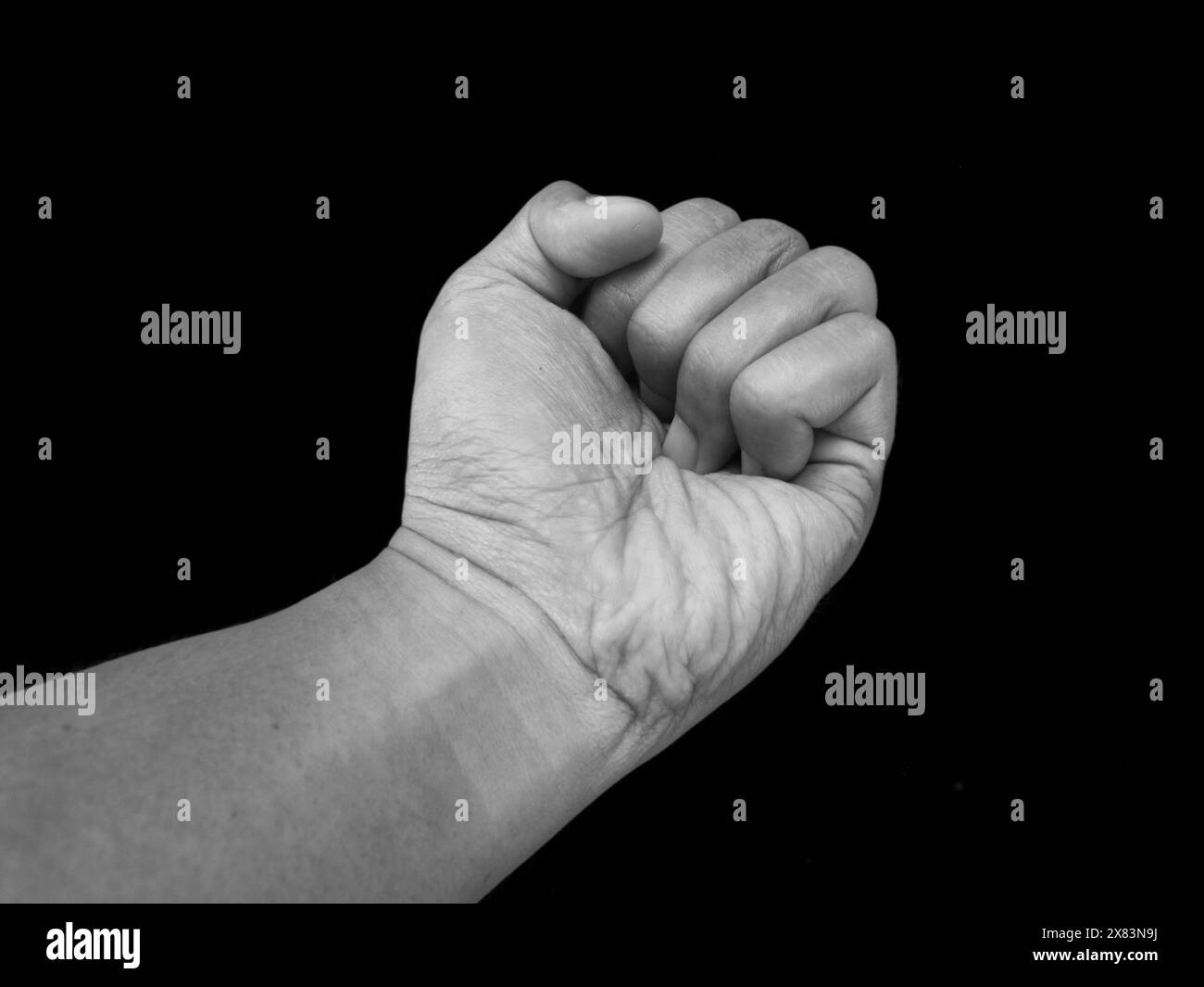 Gestures Hand Punching, Agression, Isolated on Black Background Stock