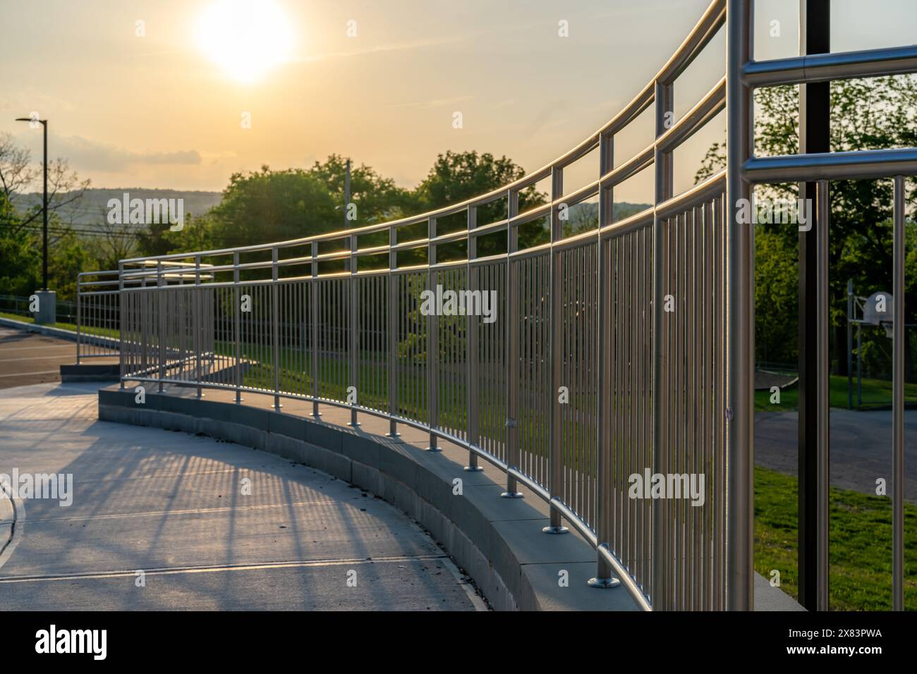 Example of a stainless steel railing along an exterior set of stairs at ...