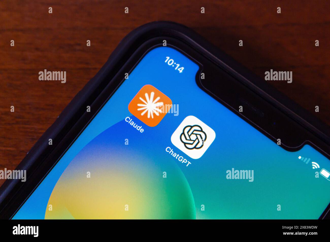 Vancouver, CANADA - May 20 2024 : Claude by Anthropic and ChatGPT (OpenAI) app icons seen in an iPhone screen. Stock Photo