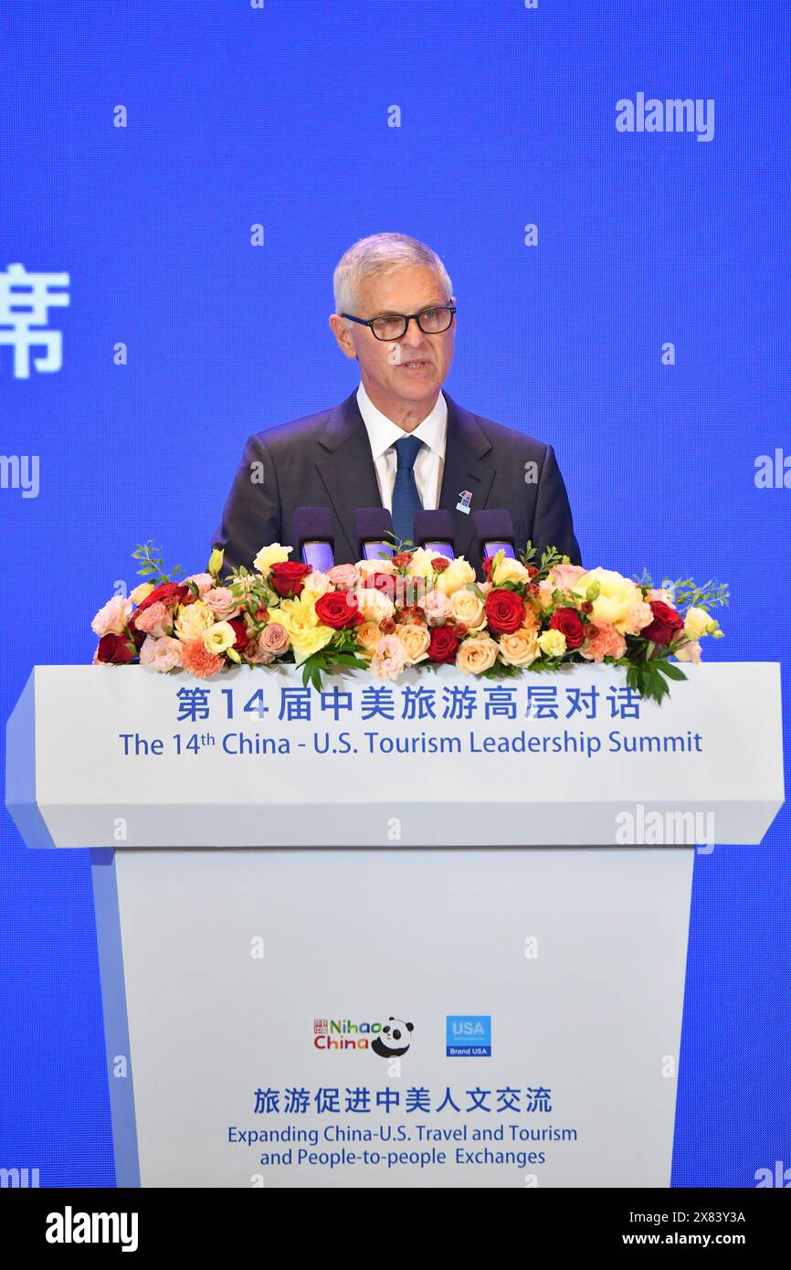 (240523) -- XI'AN, May 23, 2024 (Xinhua) -- Christopher J. Nassetta, President & CEO of Hilton and National Chair of U.S. Travel Association speaks during the 14th China-U.S. Tourism Leadership Summit held in Xi'an, northwest China's Shaanxi Province, May 22, 2024. The summit opened in Xi'an on Wednesday, with the theme of 'Expanding China-U.S. Travel and Tourism and People-to-people Exchanges.' It is co-hosted by the Ministry of Culture and Tourism of China, the People's Government of Shaanxi Province, the U.S. Department of Commerce, and Brand USA. (Xinhua/Shao Rui) Stock Photo