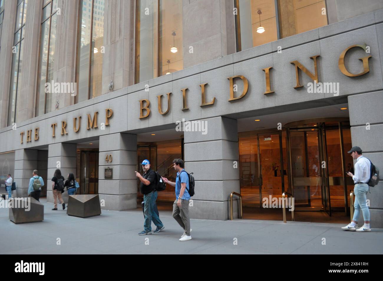 New York, USA. 21st May, 2024. People seen walking in front of the Trump building at 40 Wall Street in the Financial District in downtown Manhattan, New York City. (Credit Image: © Jimin Kim/SOPA Images via ZUMA Press Wire) EDITORIAL USAGE ONLY! Not for Commercial USAGE! Stock Photo