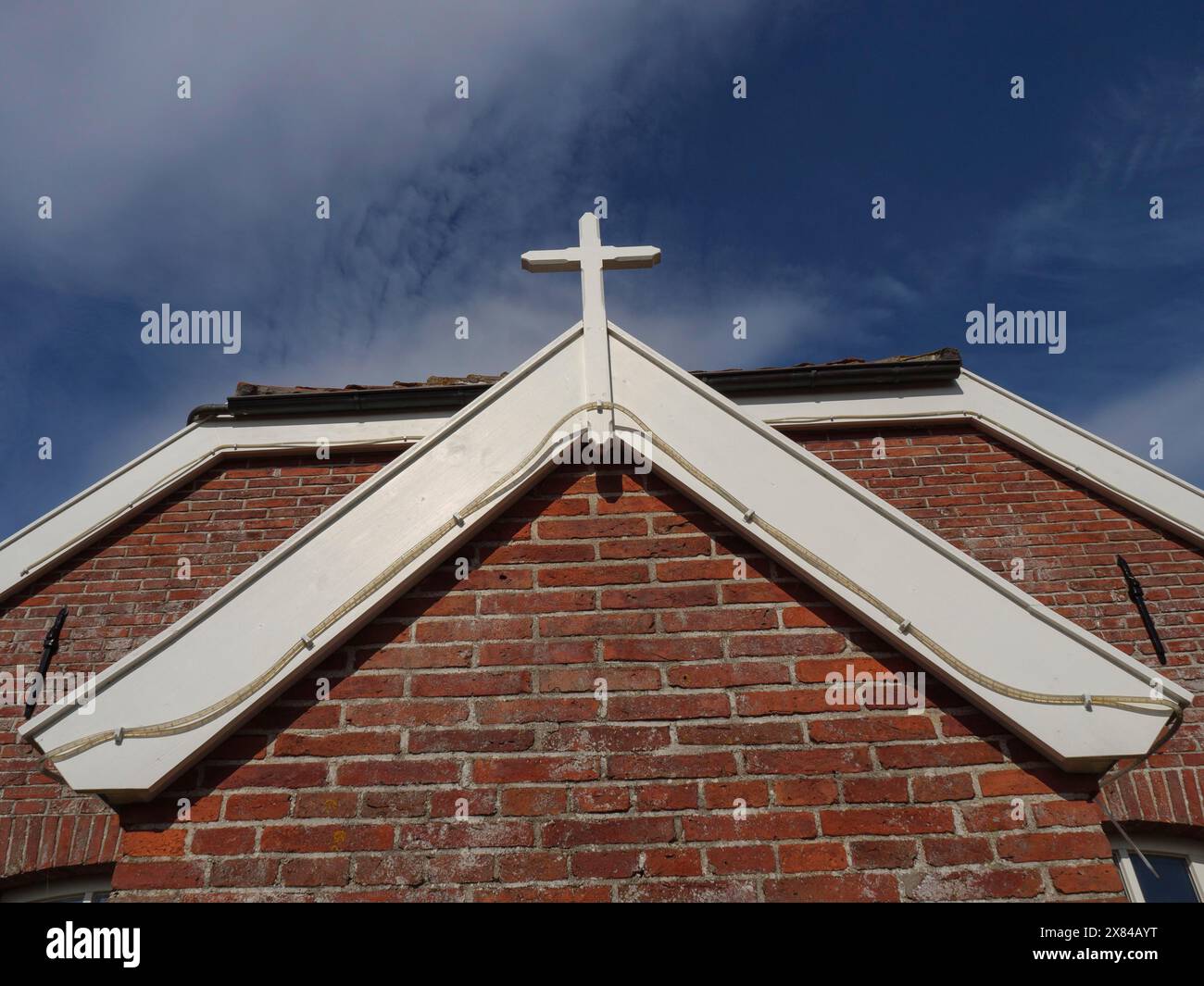 Church Roof With White Cross On Red Tiled Roof On A Clear Blue Sky church-roof-with-white-cross-on-red-tiled-roof-on-a-clear-blue-sky