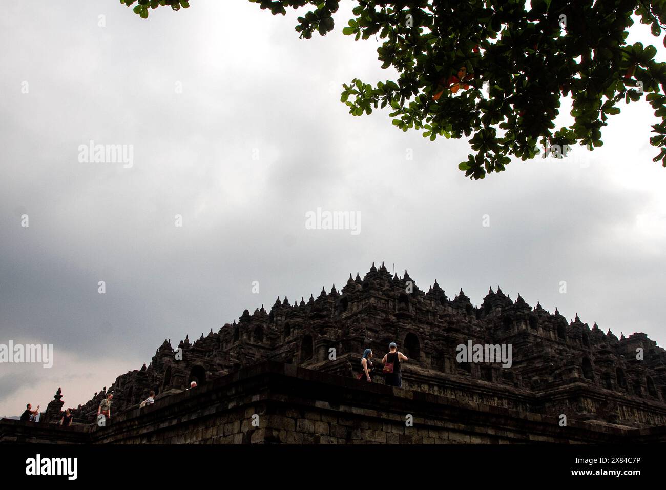 Magelang, Central Java, Indonesia. 22nd May, 2024. People visit Borobudur Temple, one of the largest Buddhist monuments in the world, in Magelang (Credit Image: © Angga Budhiyanto/ZUMA Press Wire) EDITORIAL USAGE ONLY! Not for Commercial USAGE! Stock Photo