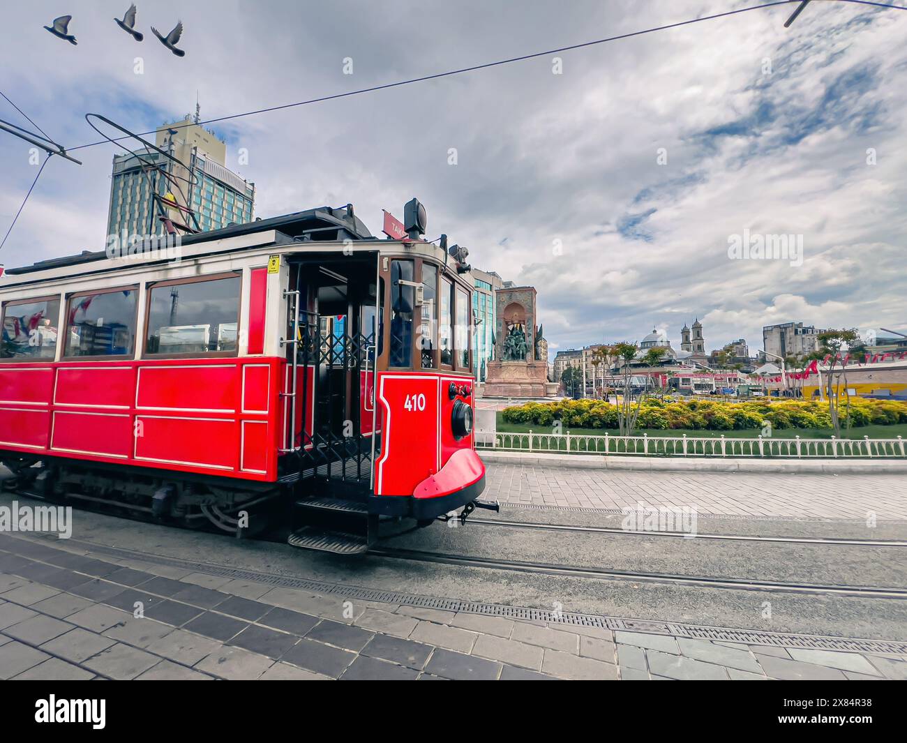 Ataturk statue and nostalgic tram in Taksim square in Istanbul Stock Photo