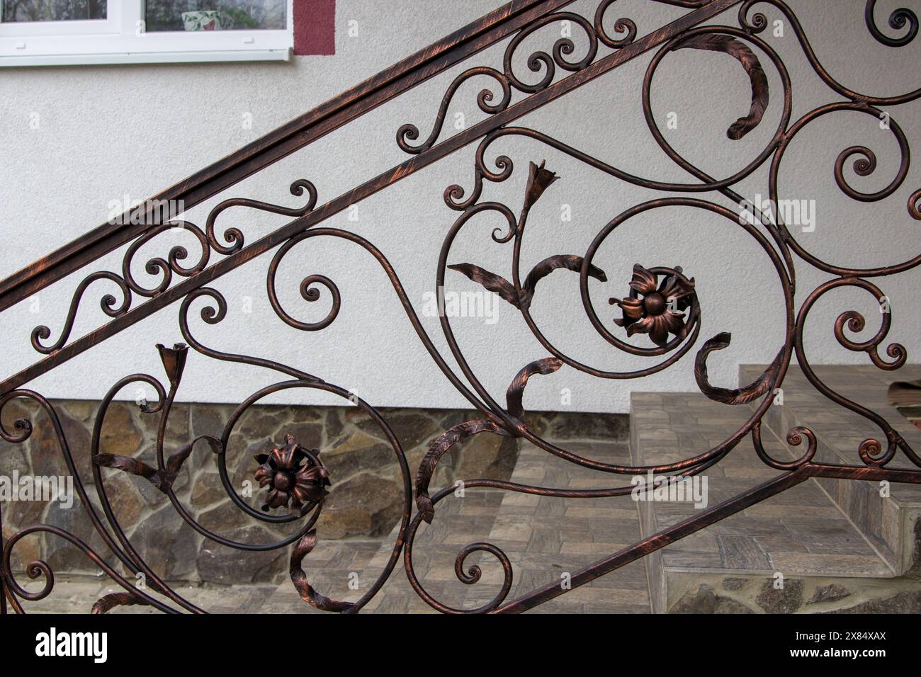 twisted metal railings on the stairs to the house Stock Photo - Alamy