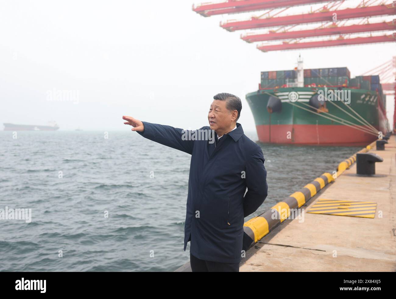 Rizhao, China's Shandong Province. 22nd May, 2024. Chinese President Xi Jinping, also general secretary of the Communist Party of China Central Committee and chairman of the Central Military Commission, visits Rizhao Port to learn about the local progress in promoting the smart and green development of the port, expanding the opening up, in Rizhao, east China's Shandong Province, May 22, 2024. Xi inspected the city of Rizhao in east China's Shandong Province on Wednesday afternoon. Credit: Ju Peng/Xinhua/Alamy Live News Stock Photo