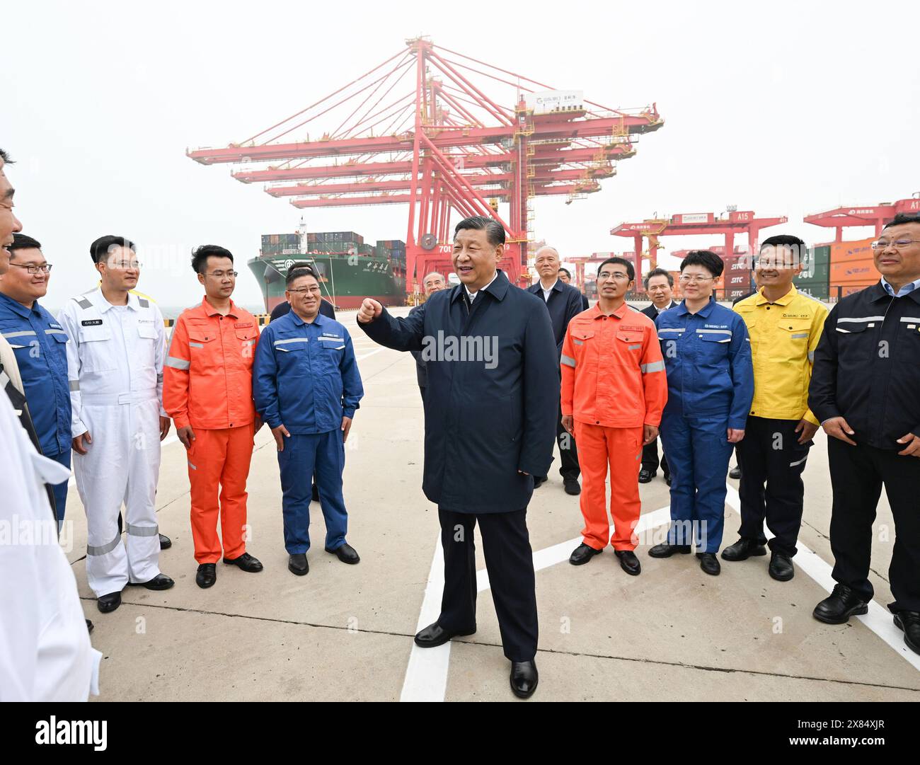 Rizhao, China's Shandong Province. 22nd May, 2024. Chinese President Xi Jinping, also general secretary of the Communist Party of China Central Committee and chairman of the Central Military Commission, visits Rizhao Port to learn about the local progress in promoting the smart and green development of the port, expanding the opening up, in Rizhao, east China's Shandong Province, May 22, 2024. Xi inspected the city of Rizhao in east China's Shandong Province on Wednesday afternoon. Credit: Xie Huanchi/Xinhua/Alamy Live News Stock Photo