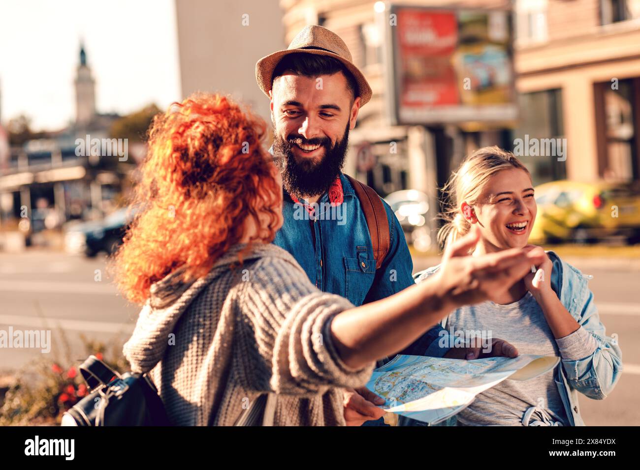 Group cheerful tourists map hi-res stock photography and images - Alamy