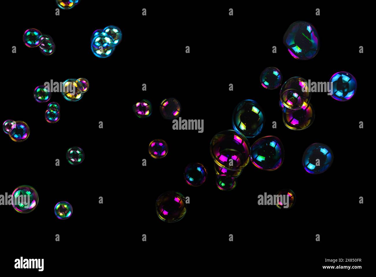 Soap bubbles isolated on a black background Stock Photo - Alamy