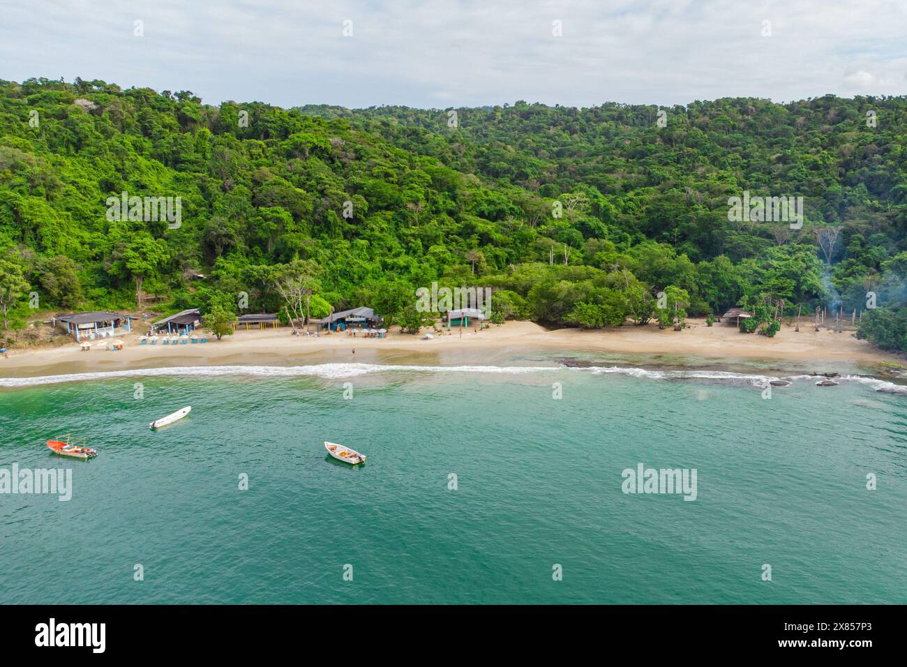 Aerial view of an idyllic caribbean beach with pristine water and white beach and forest in the Venezuelan town of Chuspa. Tropical landscape Stock Photo