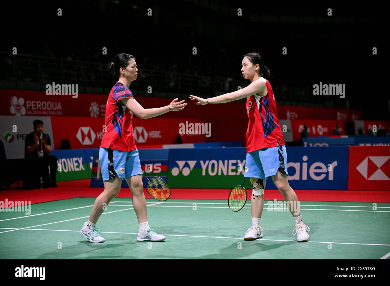 Kuala Lumpur, Malaysia. 23rd May, 2024. Li Yijing (R)/Luo Xumin of China react during the women's doubles round of 16 match against Chang Ching Hui/Yang Ching Tun of Chinese Taipei at Malaysia Masters 2024 in Kuala Lumpur, Malaysia, May 23, 2024. Credit: Cheng Yiheng/Xinhua/Alamy Live News Stock Photo