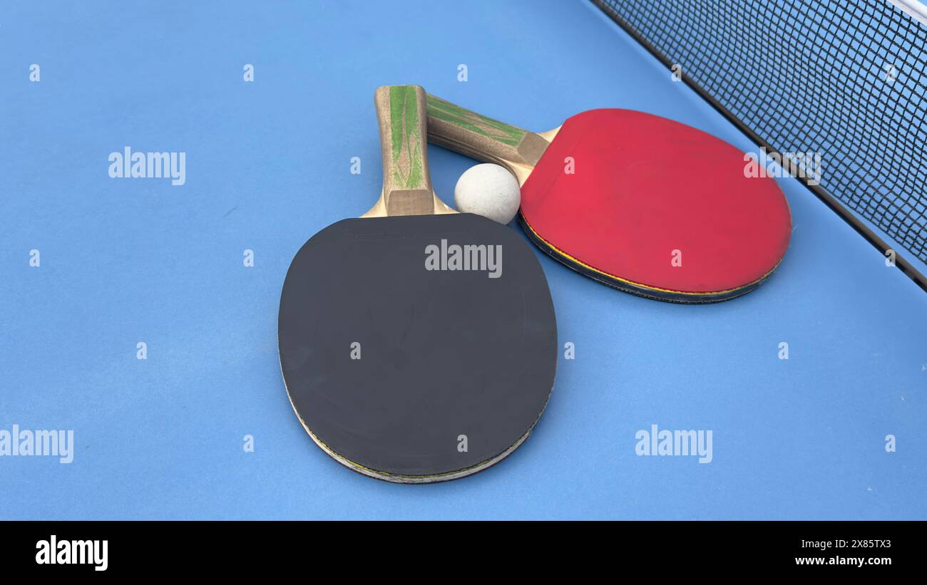 Table tennis rackets and ball on tennis table Stock Photo - Alamy