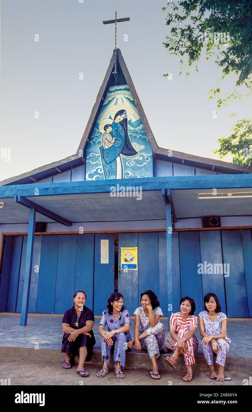 Philippines, Palawan - Women sitting in front of a wooden church Stock ...