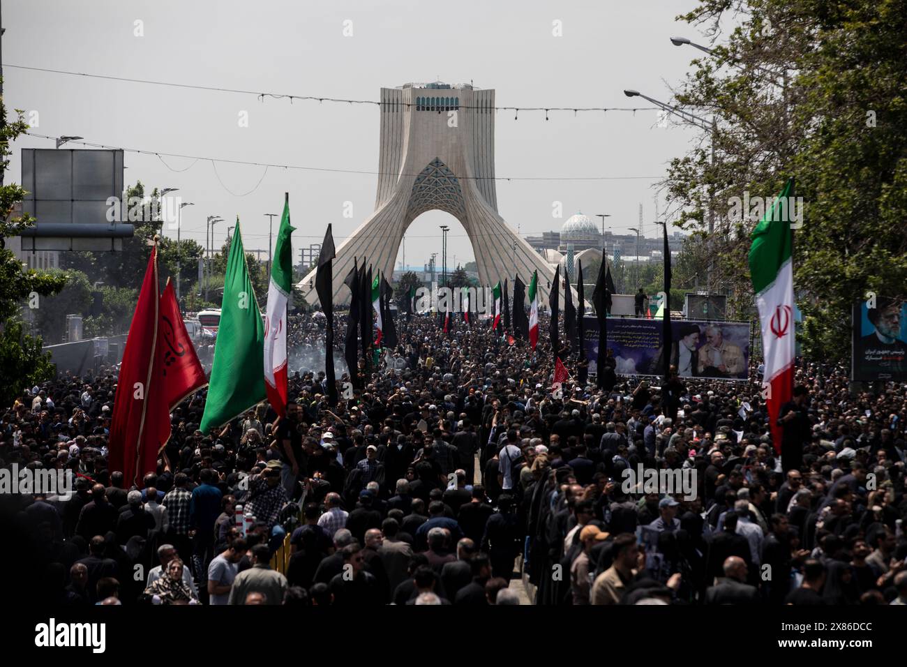 Tehran, Tehran, Iran. 22nd May, 2024. Iranians attend a funeral ceremony for the late President Ebrahim Raisi and his companions who were killed during a helicopter crash on Sunday in a mountainous region of the country's northwest, in Tehran, Iran, Wednesday, May 22, 2024. (Credit Image: © Sobhan Farajvan/Pacific Press via ZUMA Press Wire) EDITORIAL USAGE ONLY! Not for Commercial USAGE! Stock Photo