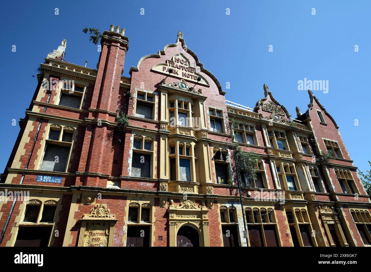 The former Trafford Park Hotel, an ornate, Edwardian, listed building on Third Avenue, Salford, disused and rundown (as of May 2024). Stock Photo