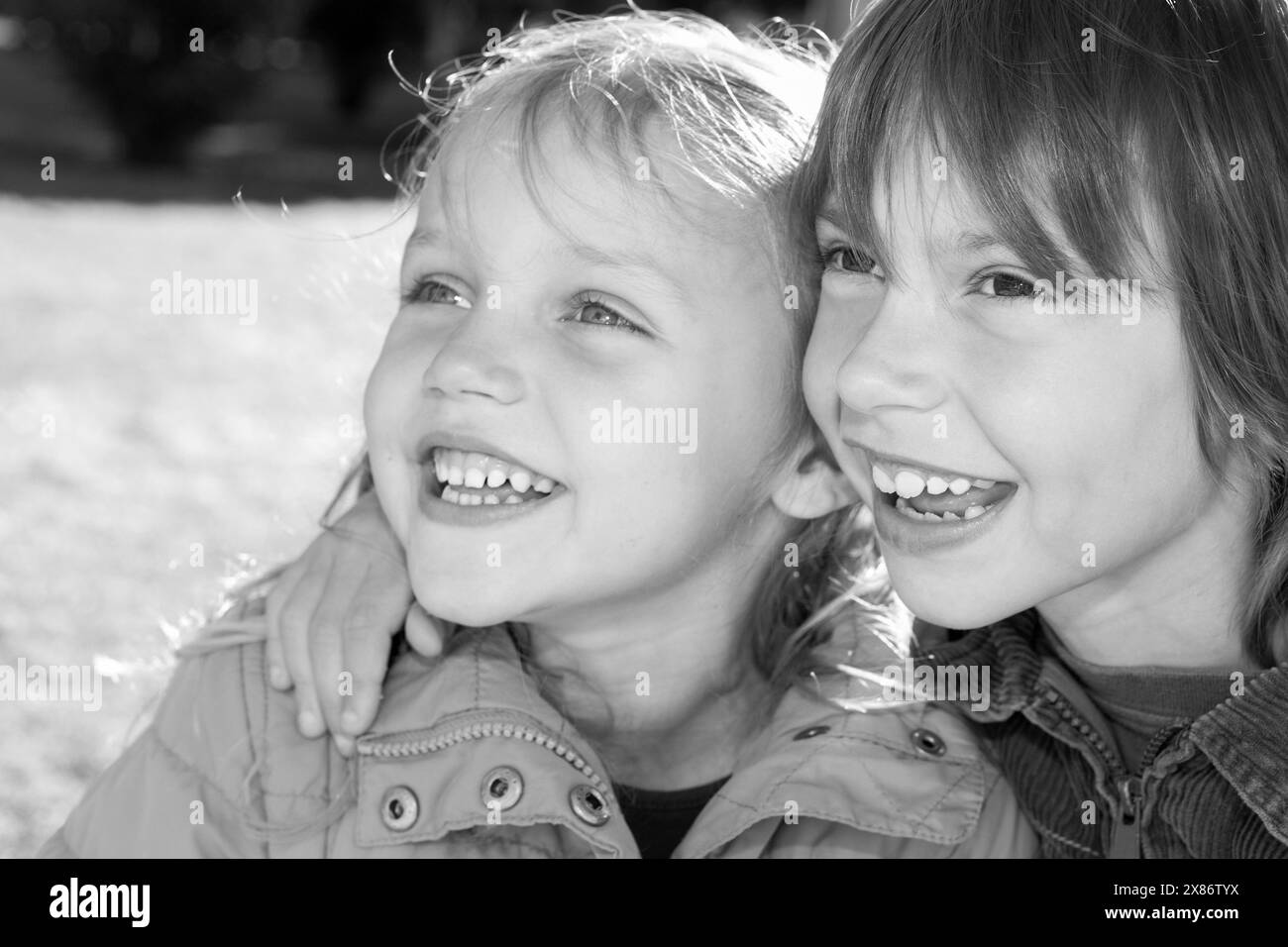 portrait of two cheerful children boy and girl outdoors Stock Photo