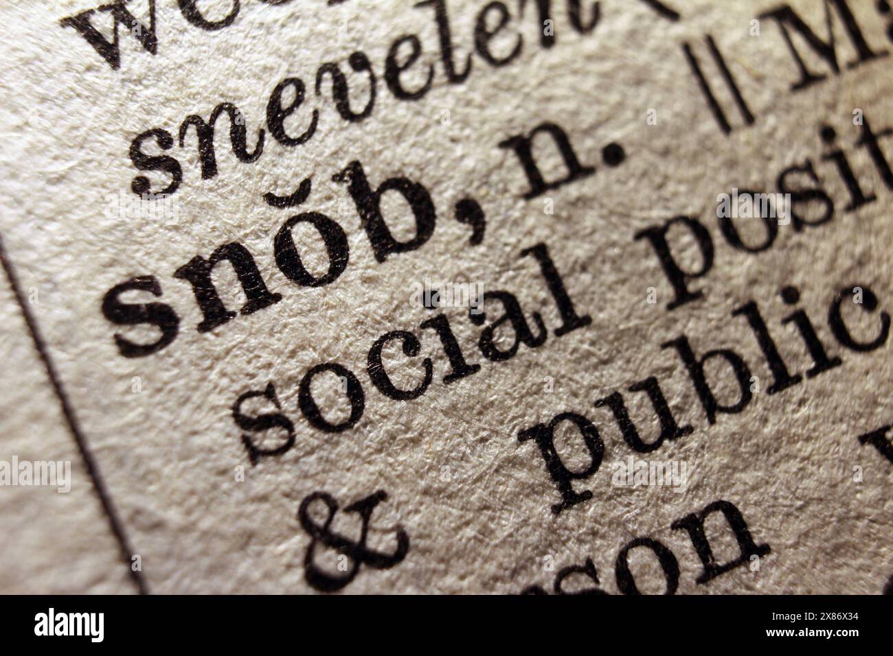 Word snob on dictionary page, macro close-up Stock Photo