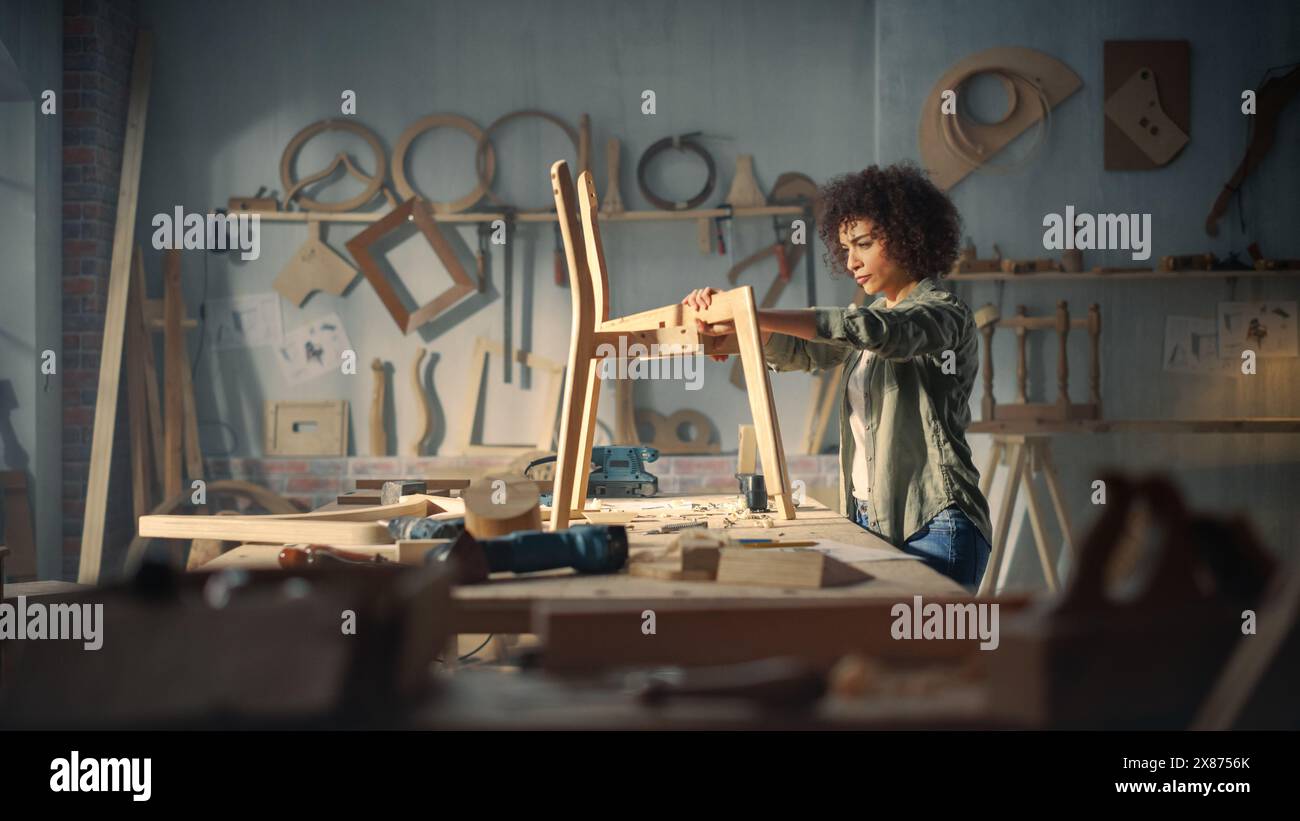 Female Artisan Furniture Designer Marking Out Dimensions on a Blueprint and Starting to Assemble