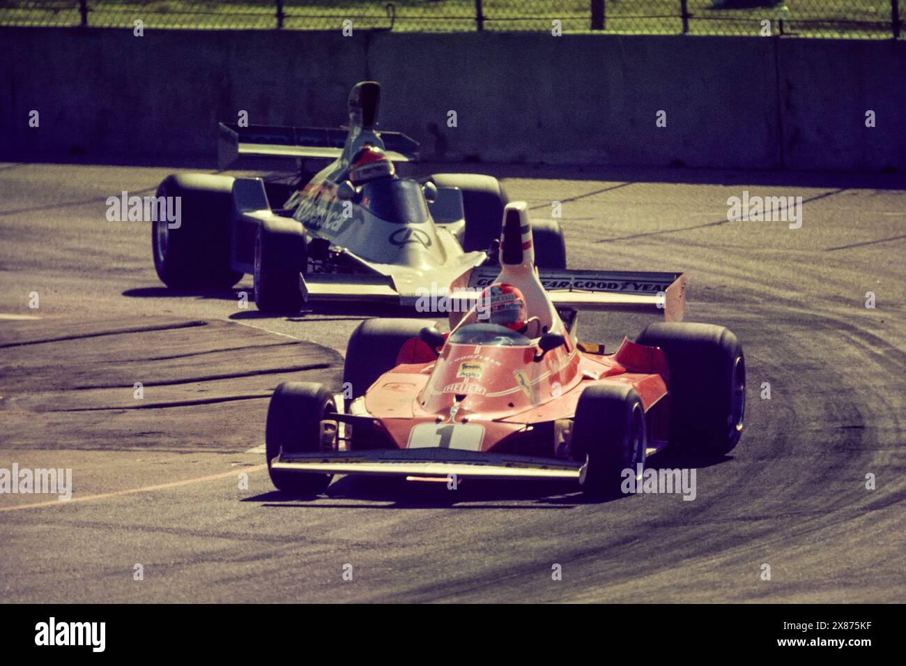 Niki Lauda in 312T Ferrari leads Emerson Fittipaldi's Fittipaldi Ford on way to 2nd place finish in Inaugural USGP West Race on March 28, 1976 in Long Beach, California. Stock Photo