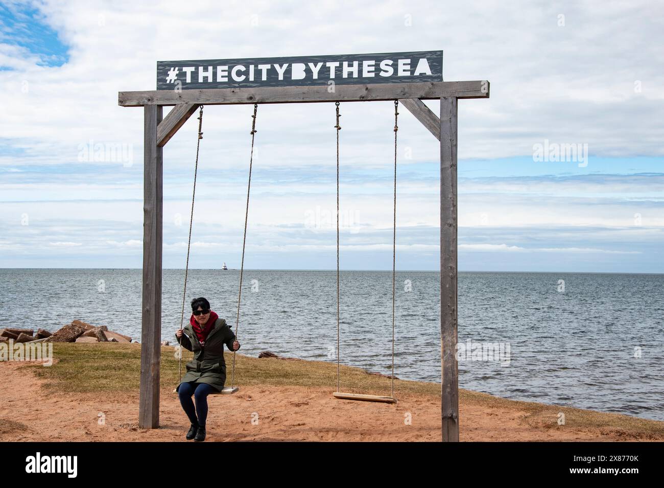 Swings with the city by the sea sign in Summerside, Prince Edward Island, Canada Stock Photo Alamy