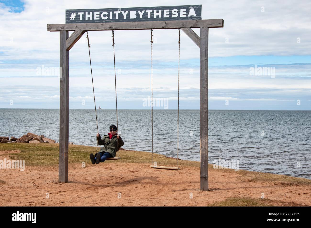 Swings with the city by the sea sign in Summerside, Prince Edward Island, Canada Stock Photo Alamy
