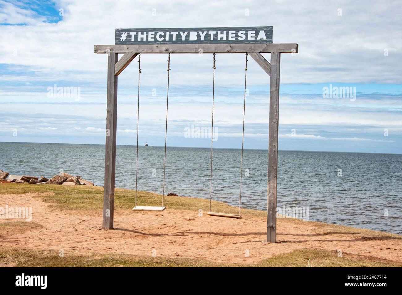 Swings with the city by the sea sign in Summerside, Prince Edward Island, Canada Stock Photo Alamy