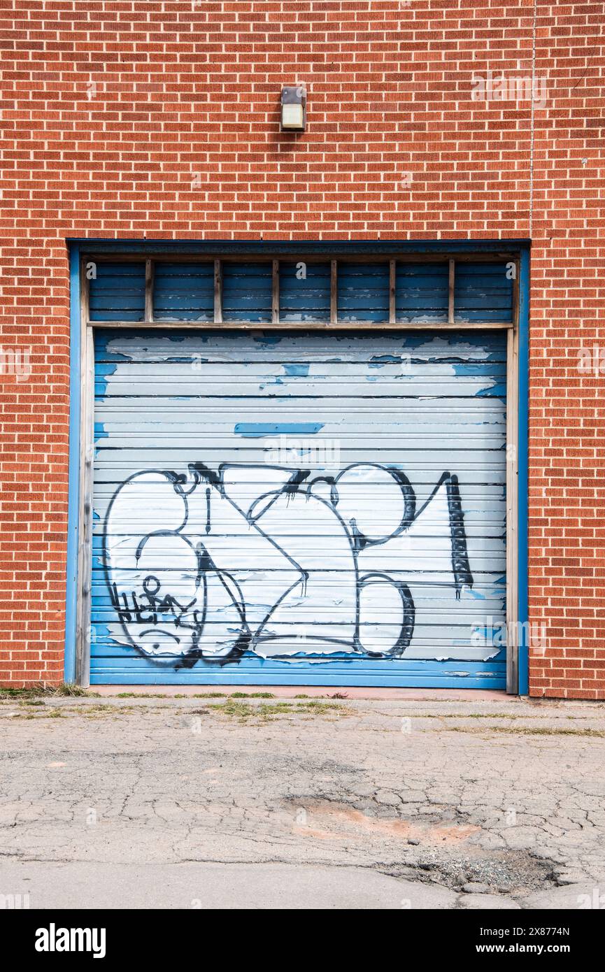 Graffiti on a garage door in downtown Summerside, Prince Edward Island, Canada Stock Photo