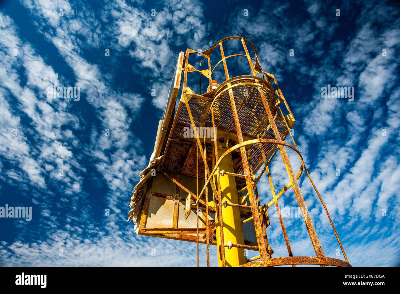 maritime lighthouse with yellow radio beacon used to guide ships worn
