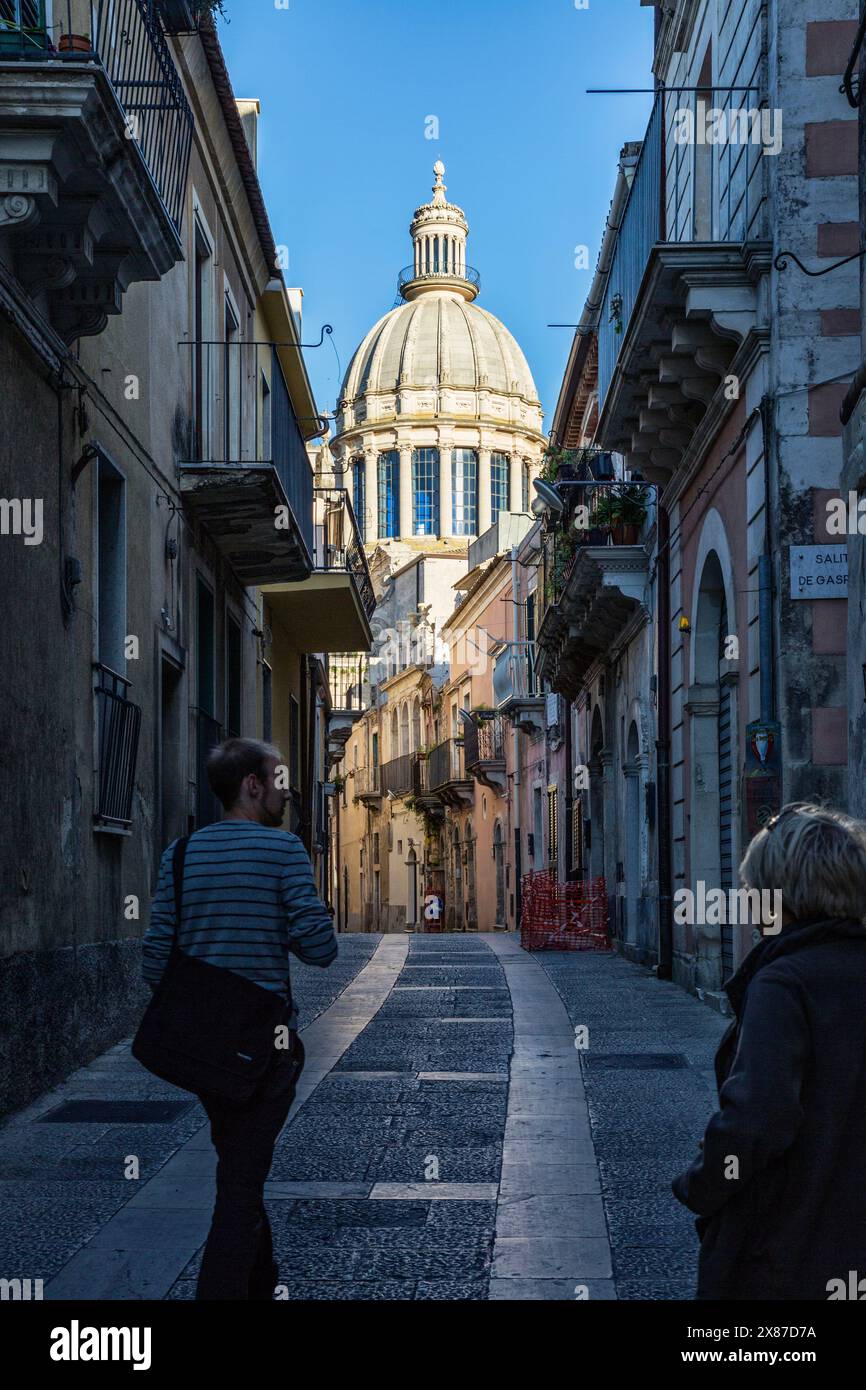 View from an old town alley to Duomo di San Giorgio, Ragusa Ibla, Ragusa, Sicily, Italy Stock Photo