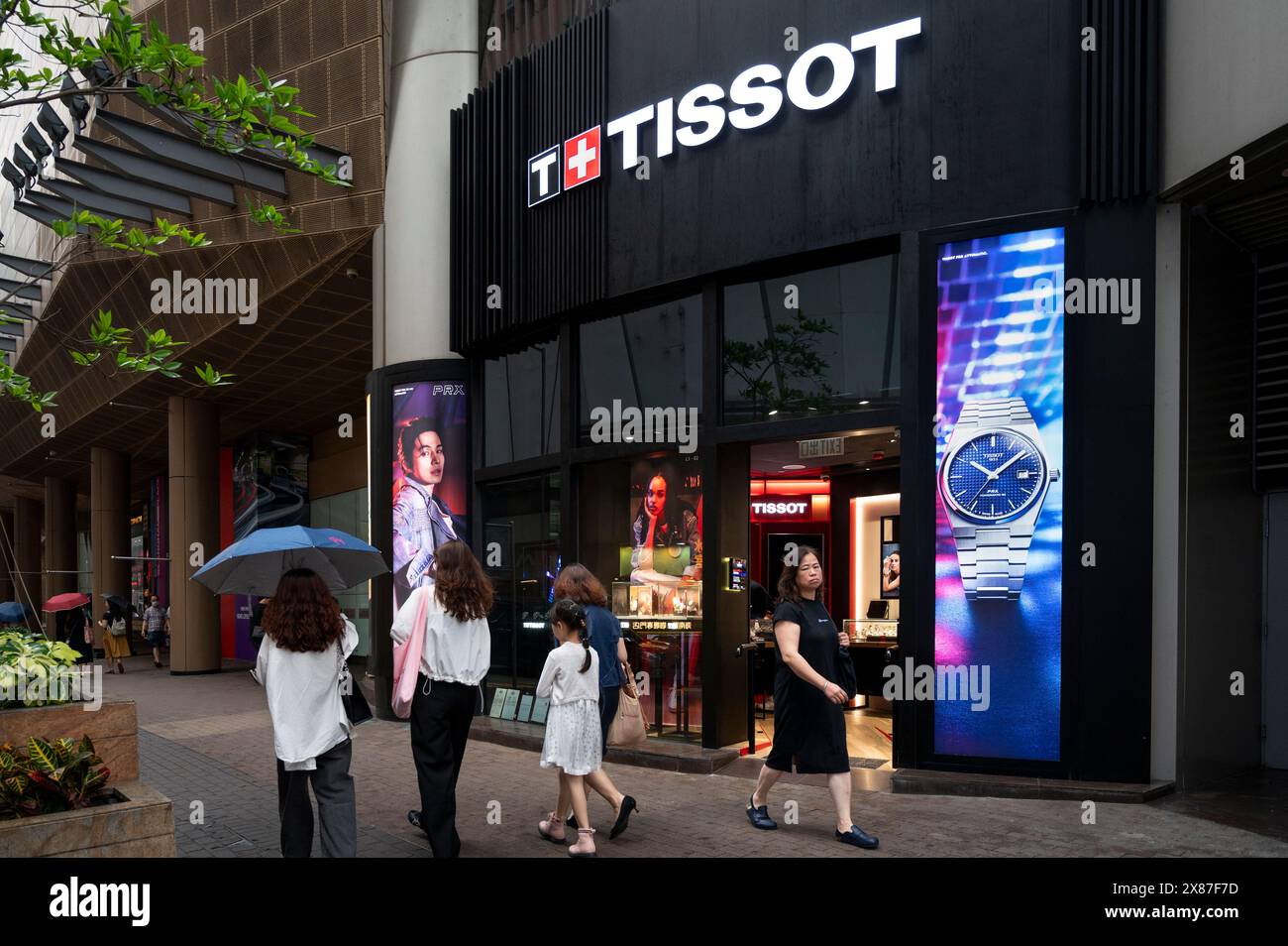 Hong Kong, China. 23rd May, 2024. Pedestrians walk past the Swiss luxury watchmaker Tissot store seen in Hong Kong. (Photo by Sebastian Ng/SOPA Images/Sipa USA) Credit: Sipa USA/Alamy Live News Stock Photo