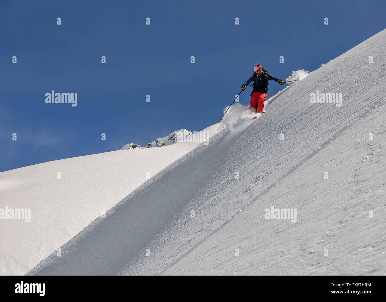 Man enjoying on snowy mountain under sky Stock Photo