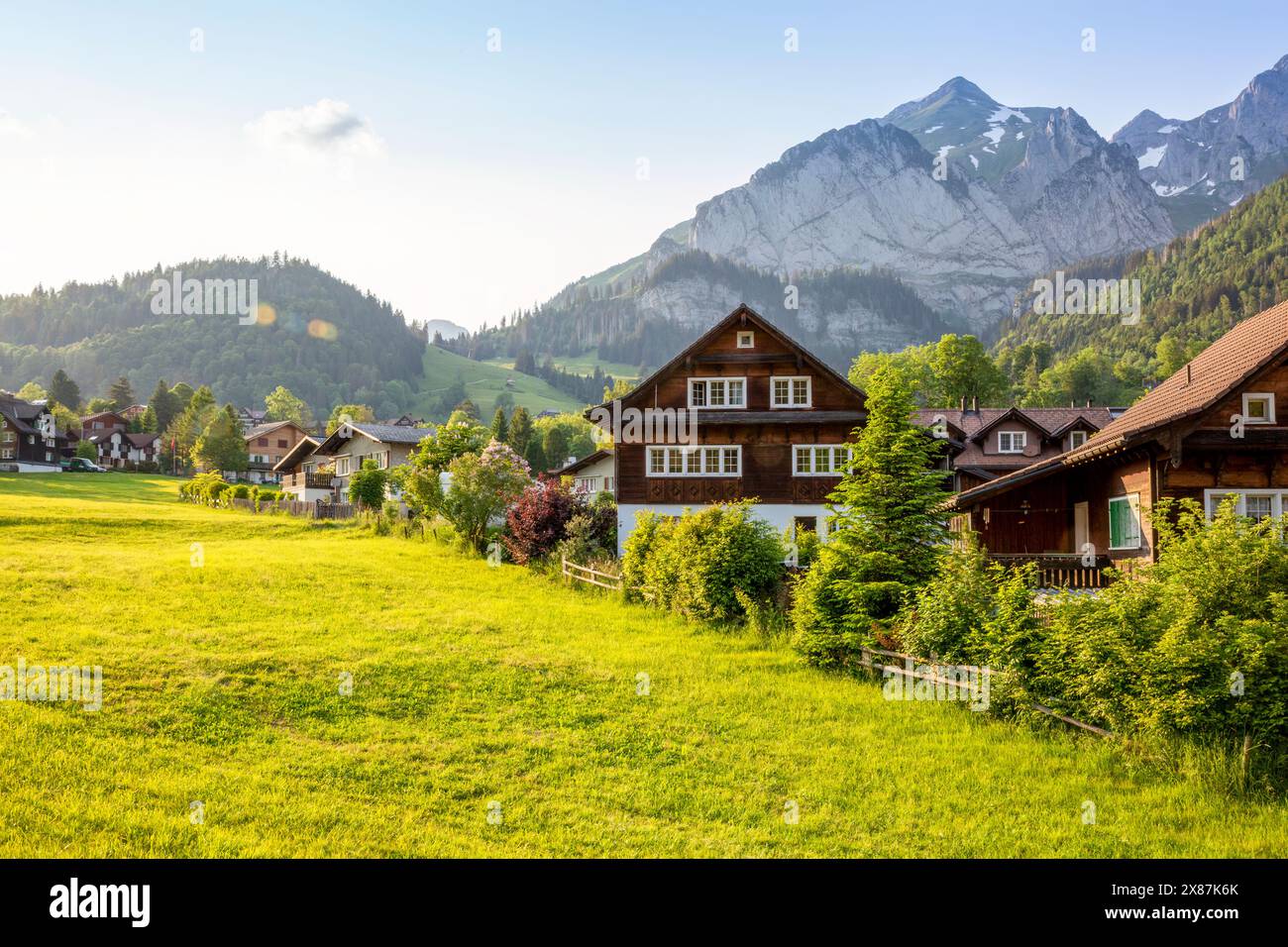 Houses in village near mountain range Stock Photo