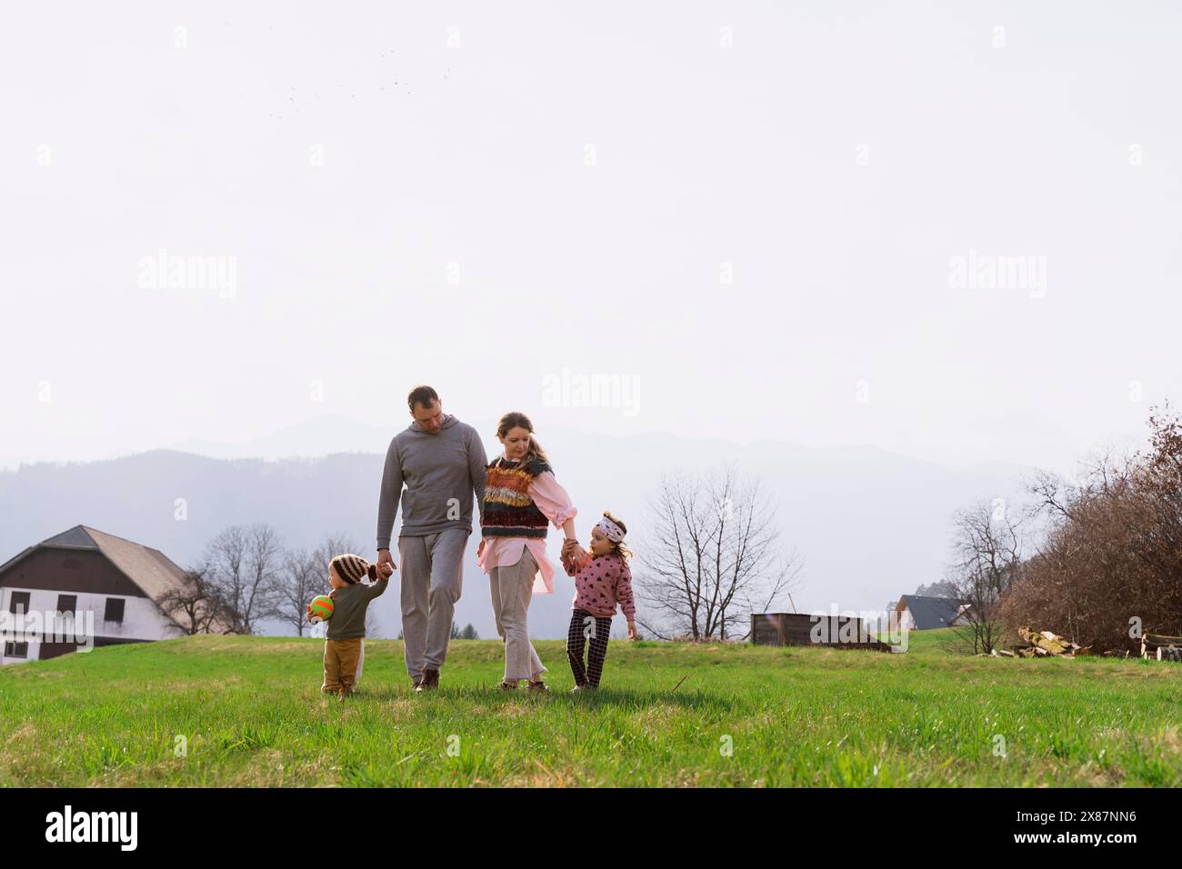 Children parents walking home hi-res stock photography and images - Alamy