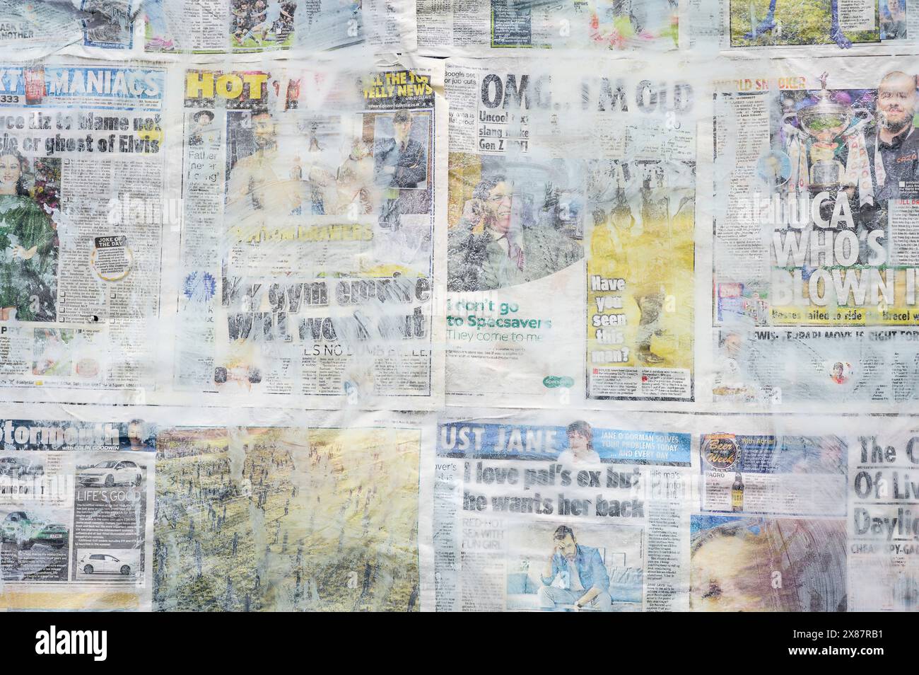 Window covered with newspapers for privacy, Scotland, UK Stock Photo