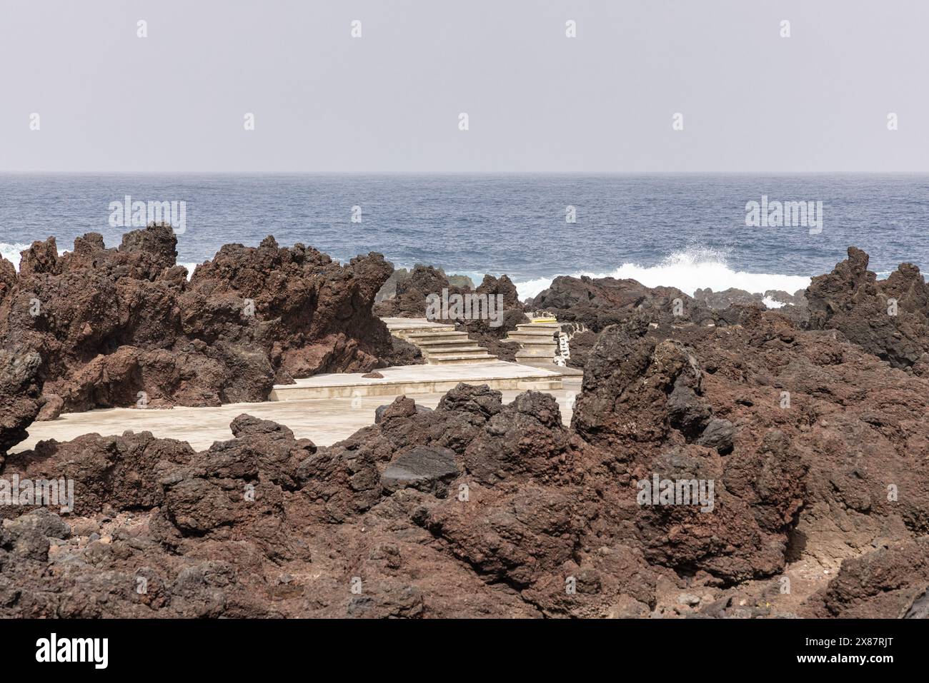 Biscoitos, Terceira, Azores, Portugal. Concrete pathway through lava ...