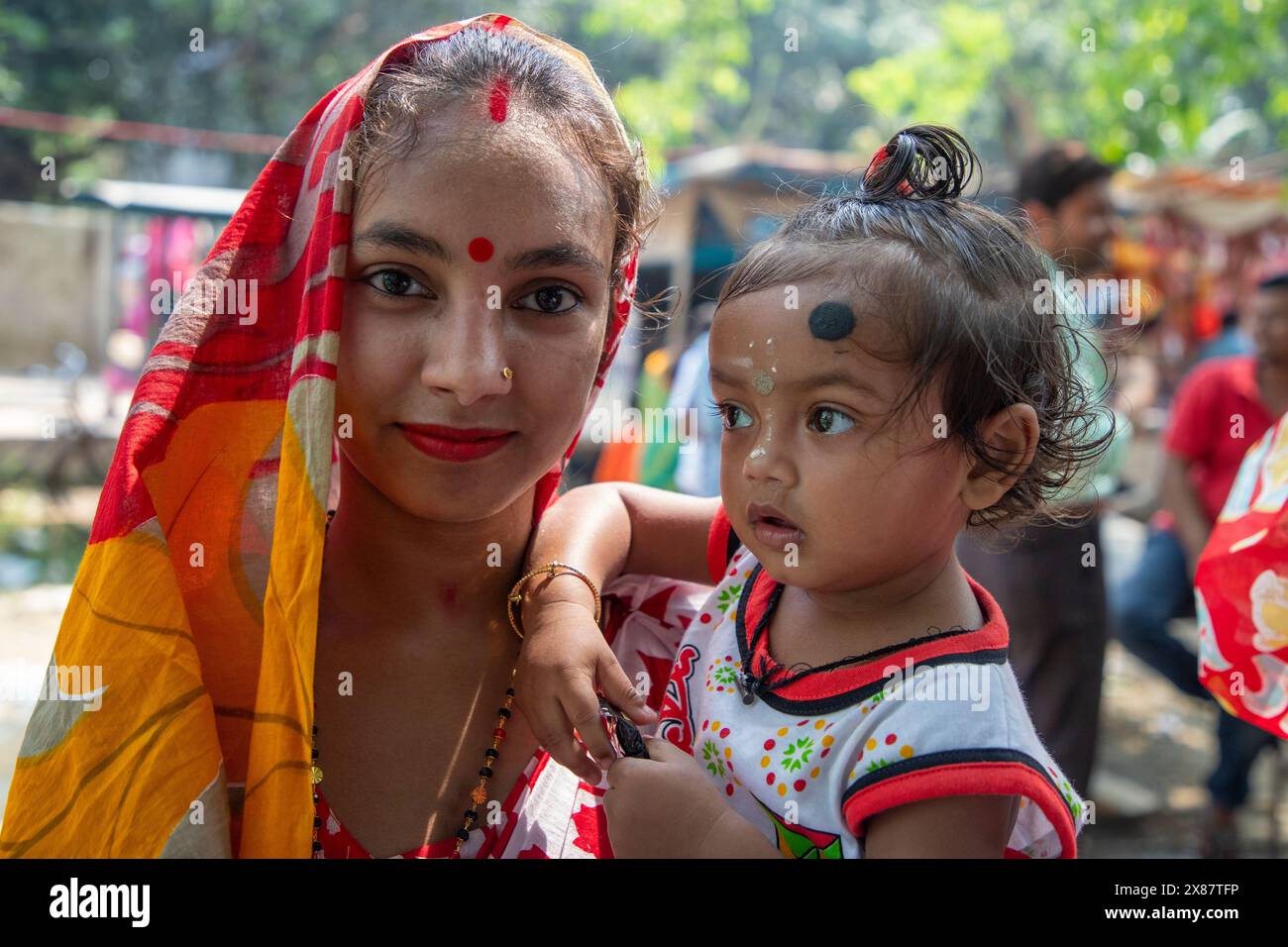 Local Indu A Hindu mother and child attend at the `Boumela’ at Sonargaon Upazila ...