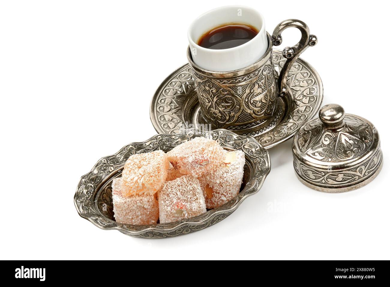 Aromatic black coffee in a stylish cup and Turkish delight isolated on a white background. Stock Photo